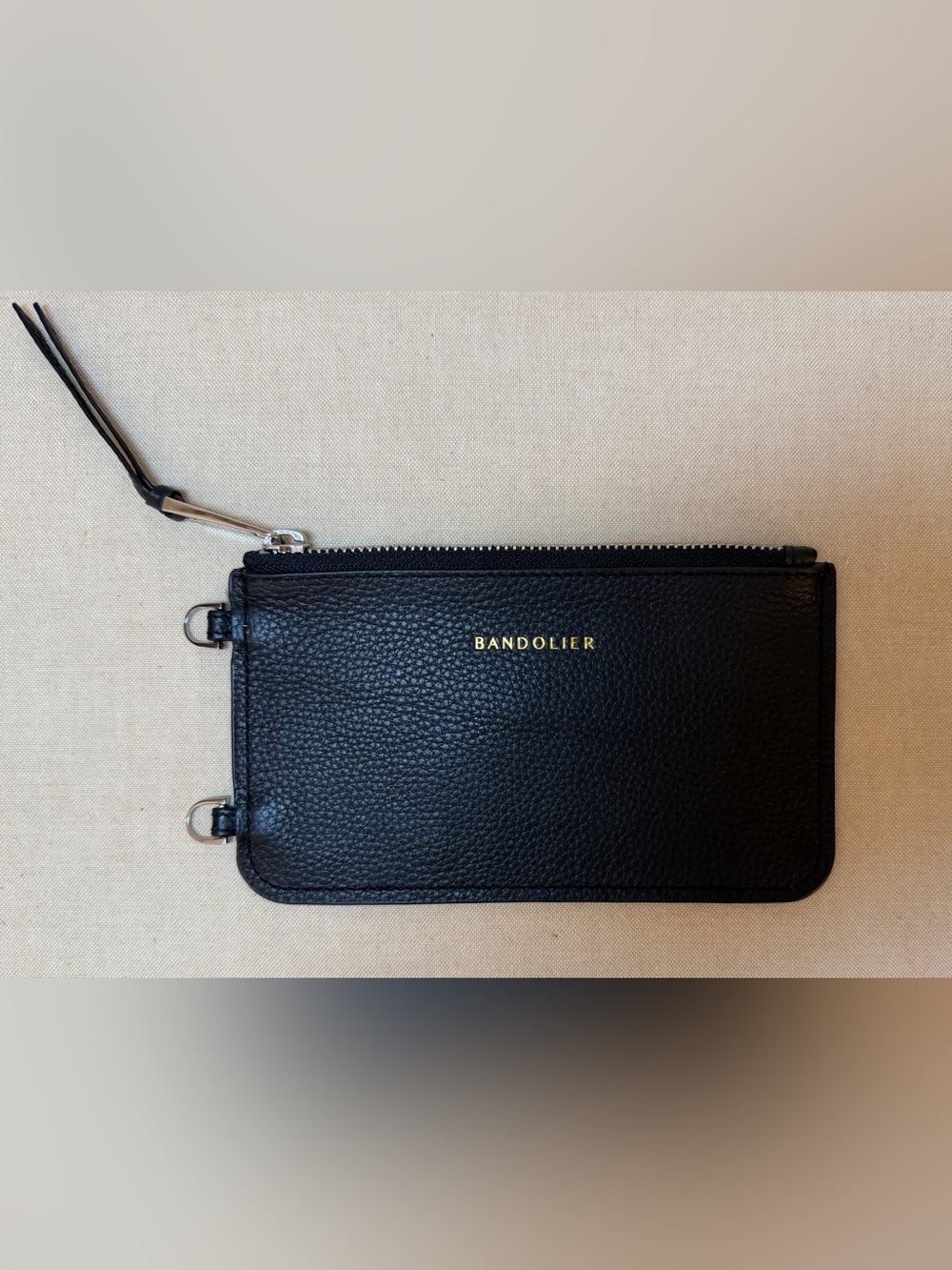 Bandolier Black Pebbled Leather Wristlet with Gold Logo
